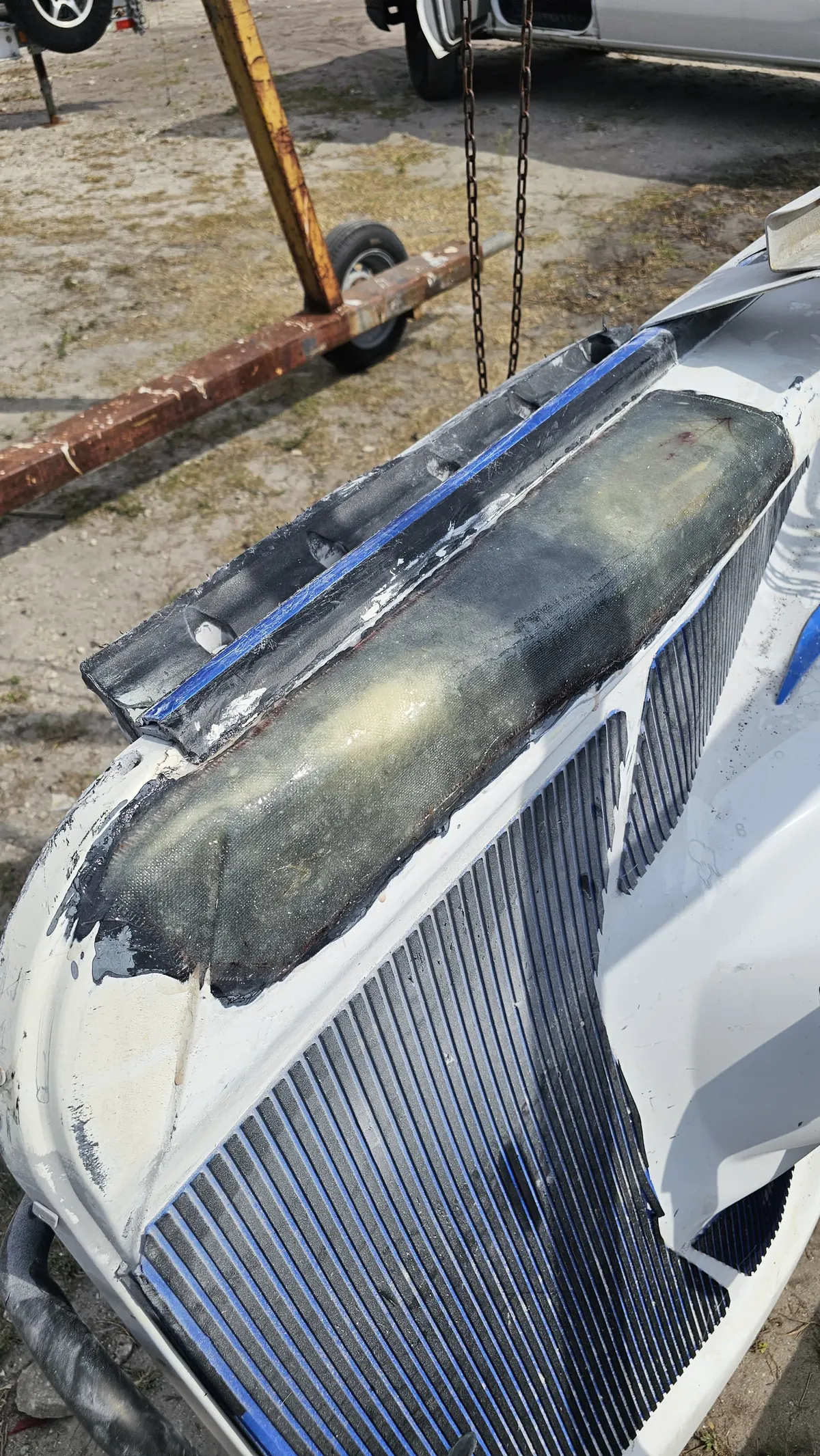Before repair on a jet ski surface