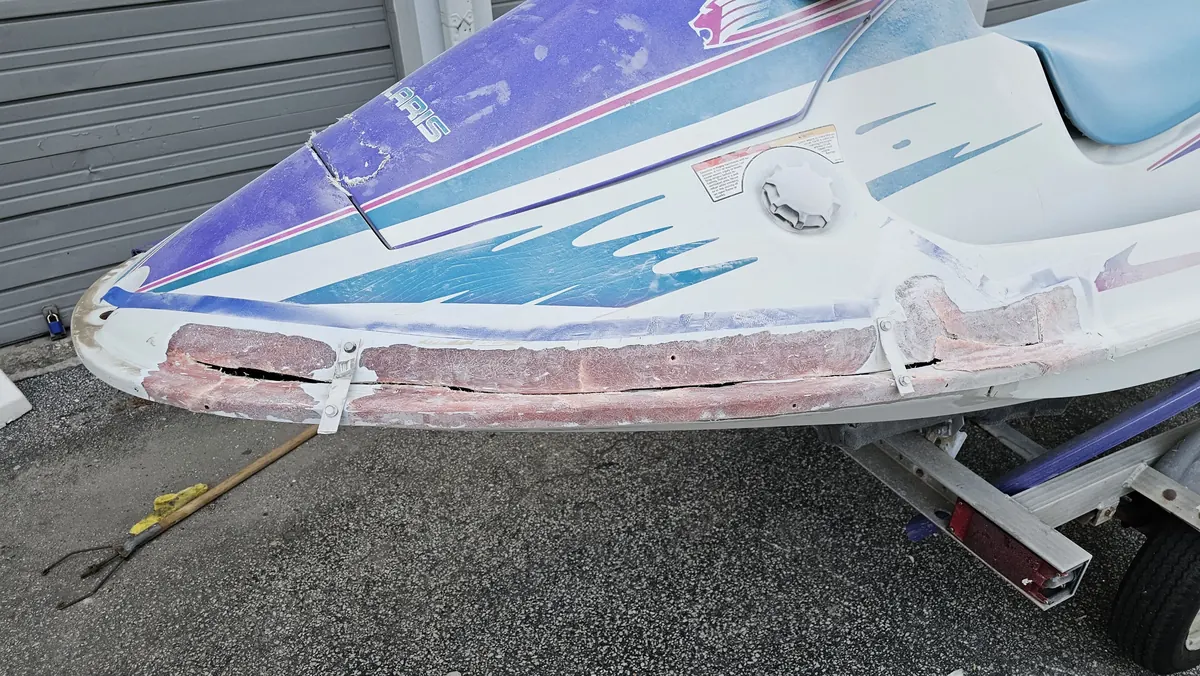 Jet ski fiberglass before repair